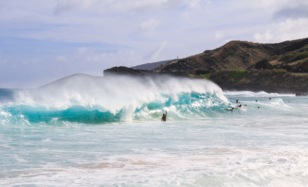 man surfing on the big wave at Sandy beach in Hawaiiの写真素材