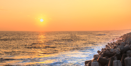 Seascape with concrete tetrapods at sunset in Jeju Island, Koreaの写真素材