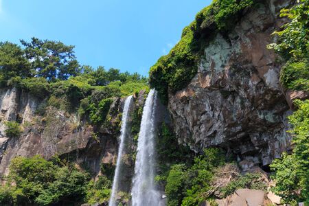 Jeongbang waterfall one of the famous travel destination in Jeju Islandの写真素材