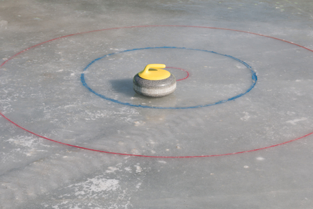 Curling stone on the iceの写真素材