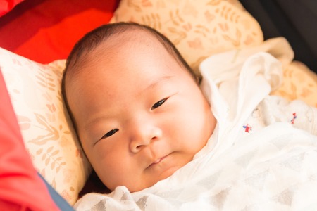 Portrait of Korean newborn babyの写真素材