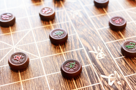 Wooden Chinese chess board and marker. The chinese character on marker indicates the branch of traditional chinese military service.の写真素材