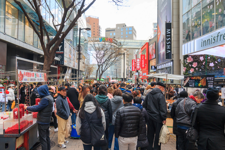 Seoul, South Korea - Mar 30, 2019: People walking down bustling Myeongdong street, one of the most popular tourists destination in Seoul.のeditorial素材