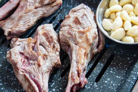 Korean style grilled lamb meat chops with garlicの写真素材