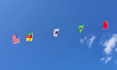 flags of all nations in the clear blue sky