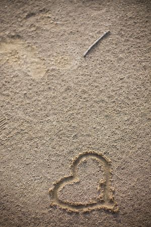 heart written on the beach to show the loveの写真素材