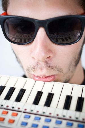 cool guy frustrated with his tiny keyboard