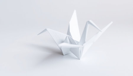 Paper origami crane isolated on white background. 3d rendering.の素材