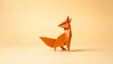 Paper origami fox isolated on orange background. Origami fox.の素材