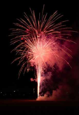 Colorful fireworks of various colors over night sky, closeup of photoの素材