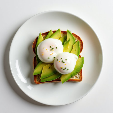 Avocado toast with poached egg on white background, top viewの素材