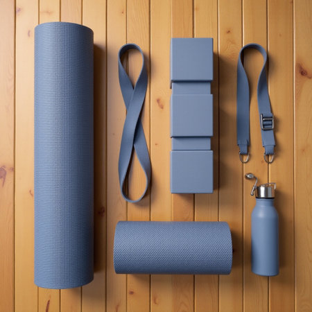 set of blue yoga mats and a bottle of water on a wooden backgroundの素材