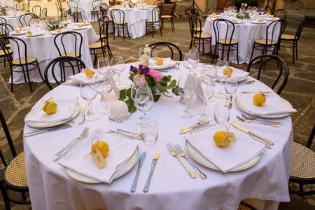 Outdoor summer Wedding table with flowers and lemon decorations.の写真素材