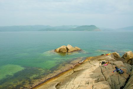 Primorski Territory. Zarubino. A bay, stones. Rockのeditorial素材