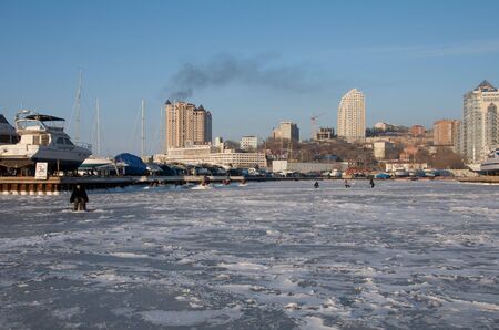 Fishermen on the ice in winterのeditorial素材
