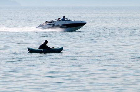 Vladivostok. Amur Bay. Fisherman and boat.のeditorial素材