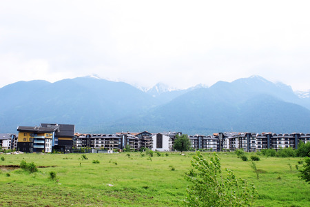 Hotel buildings at the foot of Pirin mountains, close to Bansko - famous ski resort in Bulgariaのeditorial素材