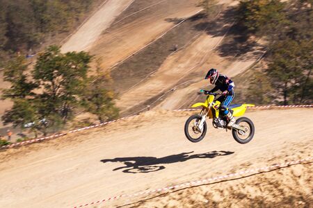 The motorcyclist is landing. Motocross. Sports. In the background draw.. A pleasant blur.の写真素材