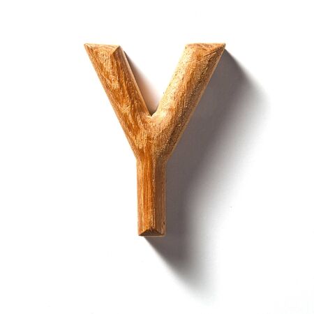 Wooden alphabet letter with drop shadow on white background, Yの写真素材