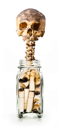 Skull with cigarettes in bottleの写真素材