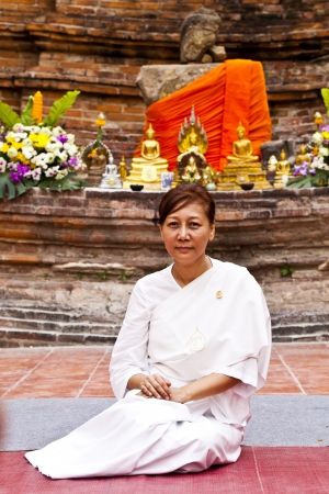 AYUTHAYA, THAILAND - JUN 24 : The religious practices of Buddhist in Visakha Puja Day on June 24, 2013. Ayuthaya, Thailand.Visakha Puja Day is the three important incident of Budhha, birth day, enlightenment and nibbana.のeditorial素材