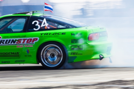 NONTHABURI THAILAND-JUNE 30 : A. Ongkaew, Thai driver from Run-Stop Tire  Team
 in D1 Grand Prix Series Thailand Professional Drift on June 30, 2013  in Nonthaburi, Thailand.のeditorial素材
