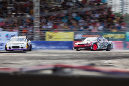 NONTHABURI THAILAND-JUNE 30 : Battle lap of two drift drivers  in D1 Grand Prix Series Thailand Professional Drift on June 30, 2013 in Nonthaburi, Thailand.のeditorial素材