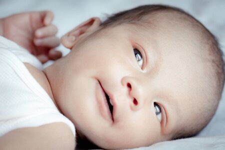 Portrait of cute Asian baby, concept create newborn, selective focus at the eyes.の写真素材