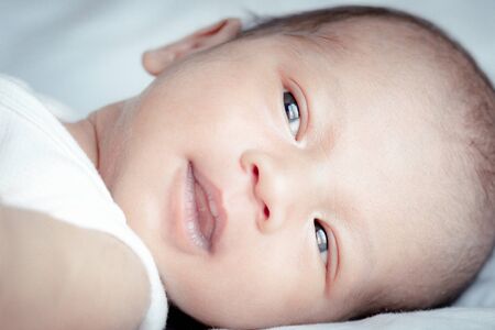 Portrait of cute Asian baby, concept create newborn, selective focus at the eyes.の写真素材
