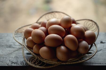 A basket with fresh eggs from the farm.の写真素材