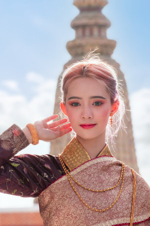 Portrait of a Thai woman wearing Thai traditional dress, as a guideline for presenting Thailand tourism business.の写真素材