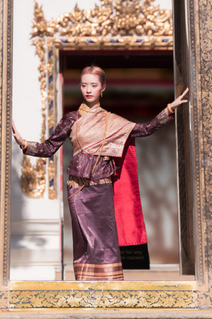 Portrait of a Thai woman wearing Thai traditional dress, as a guideline for presenting Thailand tourism business.の写真素材