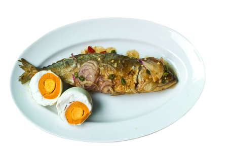 Salt and salted fish dishes on a white background の写真素材