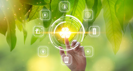 Health care and medical concept. Hand pressing health care icon on green nature background.