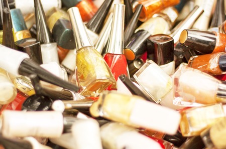 Bottles for nails, a few pieces lie in a small heapの写真素材