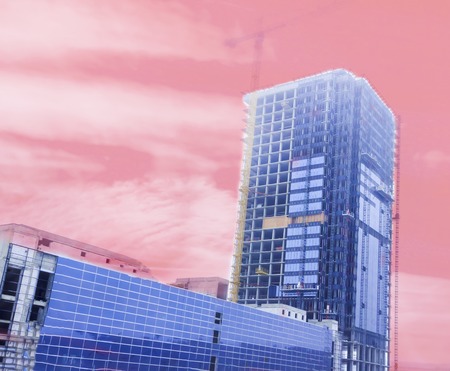 building, skyscraper. It is made of concrete and glass. Crane in the open.