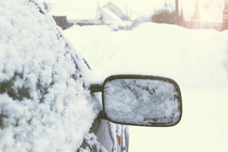 Winter, a lot of snow. The car is on a snowy roadの写真素材