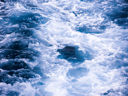 Background of bubble water after a boat, surface of sea water, macro