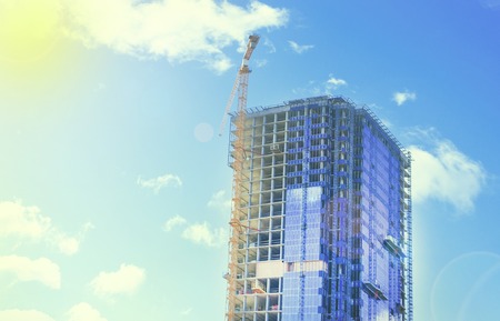 building, skyscraper. It is made of concrete and glass. Crane in the open.の写真素材