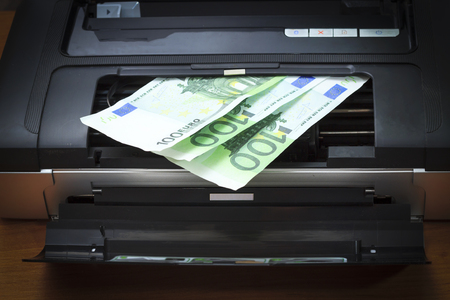 The printer, the lid is open. You see money, euro. There is vignettingの写真素材