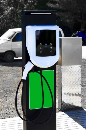 The station is white for refueling an electric car. There is a place for recording at the bottom.の写真素材