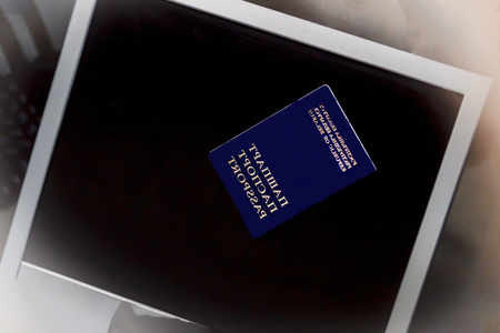 monitor on a white background but not isolated. Keyboard blue passport and money dollars and euro