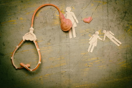 she and phonendoscope and cut out of paper children. assistance in vitro fertilization in a medical facility. There are tinted scratches added.の写真素材