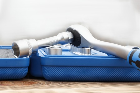 A set of heads in a blue box is not a focal point or a ratchet close-up. shallow depth of cut. there...