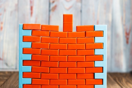 Completion of the brickwork. close-up. puts a brick. there is toning.の写真素材