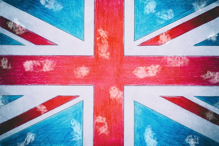 United Kingdom flag on paper, wooden background in old style. there is toning.の写真素材