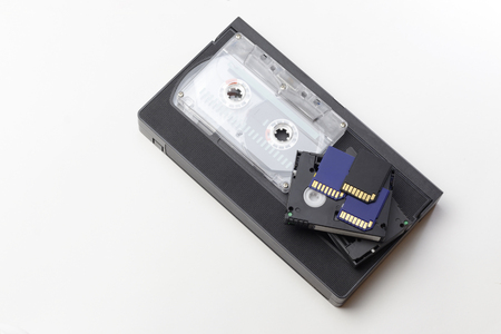 The video is big and small. Memory card to record video. The concept of perfect video storage technology. on a white background. no isolation. there is toning.の写真素材
