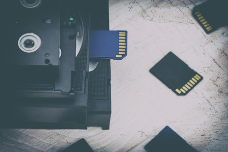 The video is big and small. Memory card to record video. The concept of perfect video storage technology. on a white background. no isolation. there is toningの写真素材