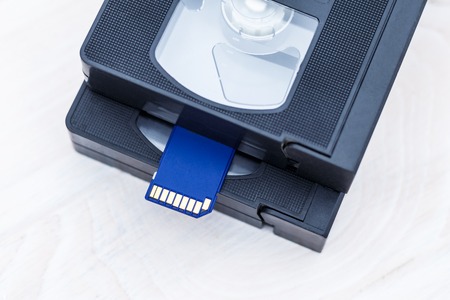 The video is big and small. Memory card to record video. The concept of perfect video storage technology. on a white background. no isolation. there is toningの写真素材