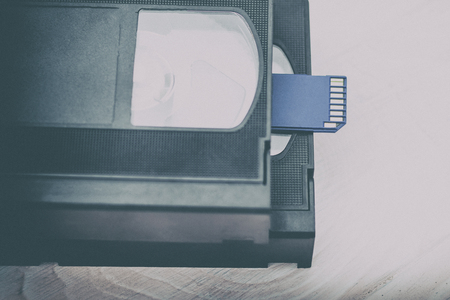 The video is big and small. Memory card to record video. The concept of perfect video storage technology. on a white background. no isolation. there is toningの写真素材